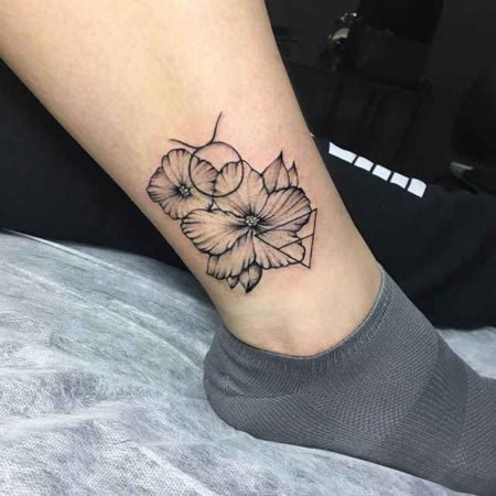 Телец и цветы тату на щиколотке